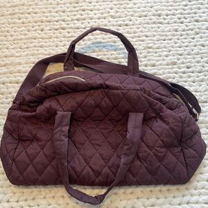 MAROON PUFFER DUFFLE BAG WITH SHOULDER STRAP AND GOLD HARDWARE